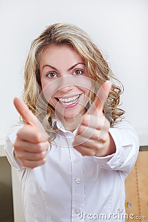 Happy business woman holding both