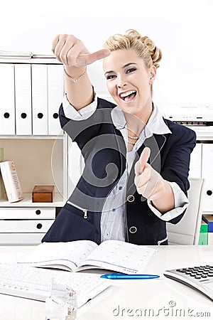 Happy business woman thumbs up