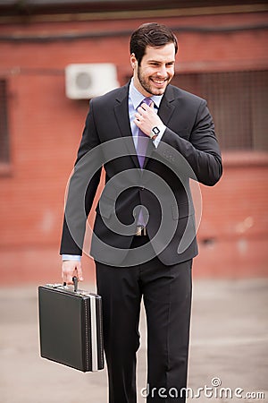 Happy businessman on the street