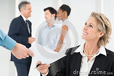 Happy Businesswoman Holding Document