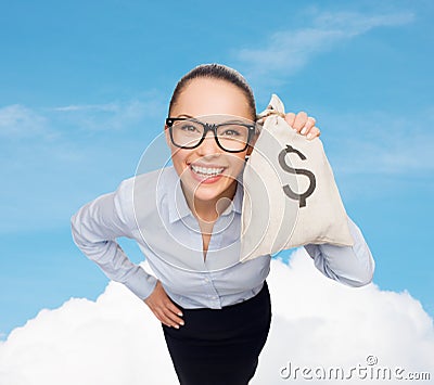 Happy businesswoman holding money bag with dollar