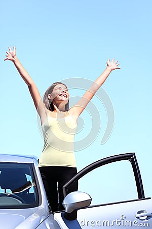 Happy car driver woman on summer road trip
