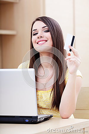 Happy casual woman shopping online