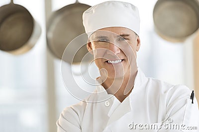 Happy Chef In Restaurant Kitchen