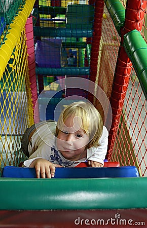 Happy child playing in the children s play center