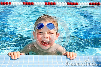 Happy child in a swimming pool