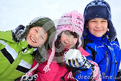 Happy children playing in snow