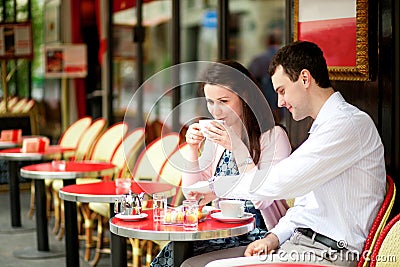 Happy couple drinking coffee
