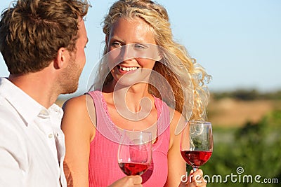 Happy couple drinking wine