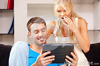 Happy couple with tablet pc computer