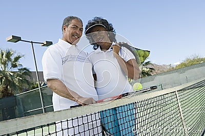 Happy Couple At Tennis Court