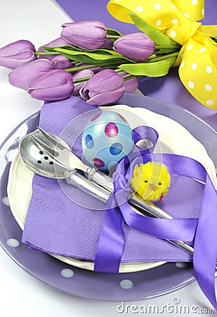 Happy Easter yellow and purple mauve lilac theme Easter table place setting - close up