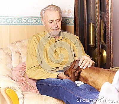 Happy elderly man with his dog