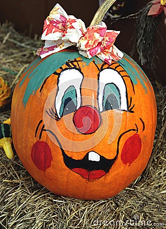 Happy face painted pumpkin