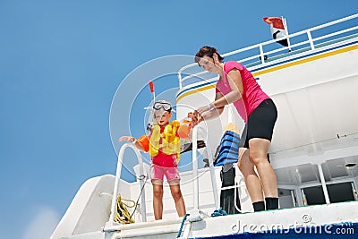 Happy family with child on yacht.