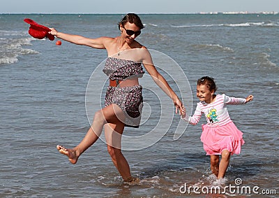 Happy family dancing at sea