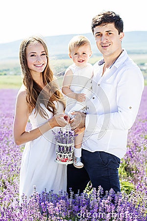 Happy family having fun in lavender field