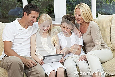 Happy Family Having Fun Tablet Computer At Home