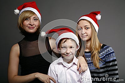 Happy family in New Year s caps