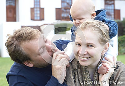 Happy family playing in the garden