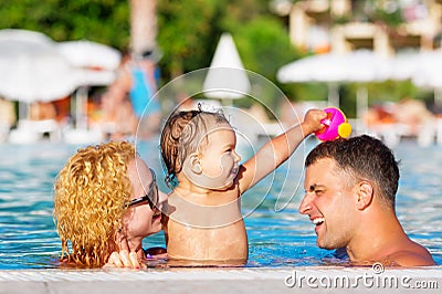 Happy family in the pool
