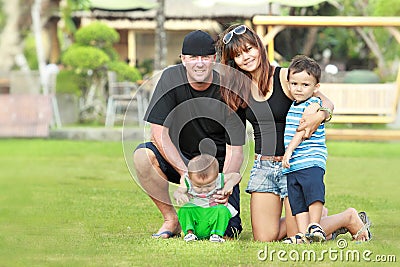 Happy family relaxing in the garden