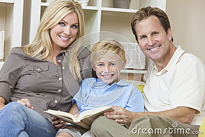 Happy Family Sitting on Sofa Reading A Book