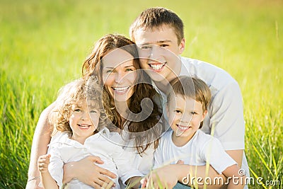 Happy family in spring field