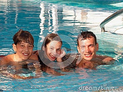 Happy family in the swimming pool