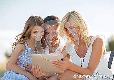 Happy family with tablet pc taking picture