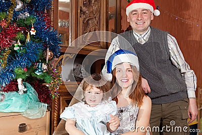 Happy family of three celebrating Christmas