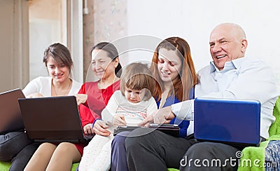 Family uses electronic devices together