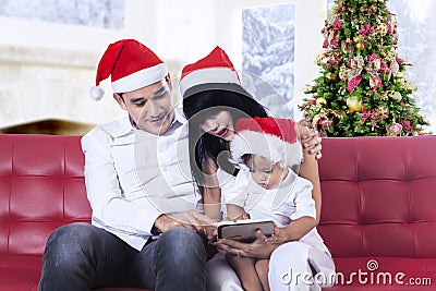Happy family using tablet computer