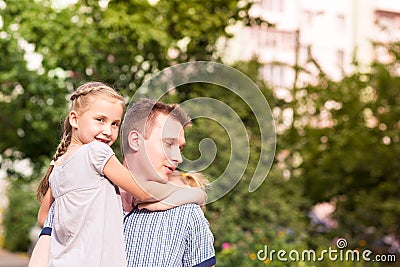 Happy father and daughter playing in the park