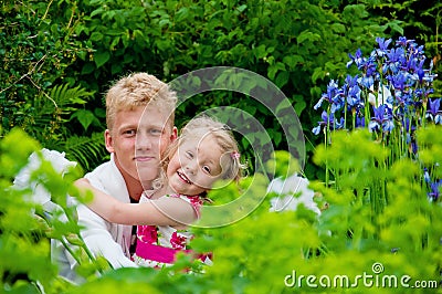 Happy father and little girl at a garden