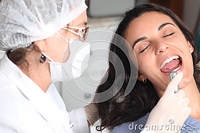 Happy female patient at the dentist