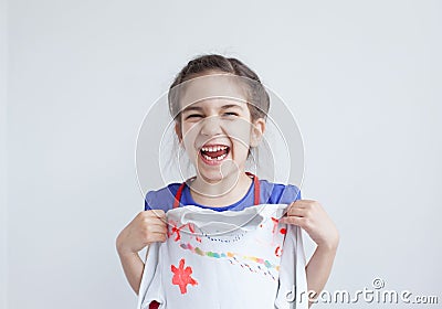 Happy girl, child with white design decorated blouse
