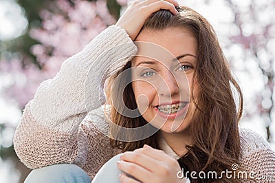 Happy girl wearing braces spring portrait