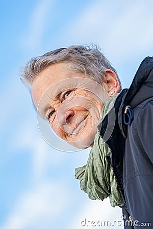 Happy grey-haired elderly woman senior outdoor