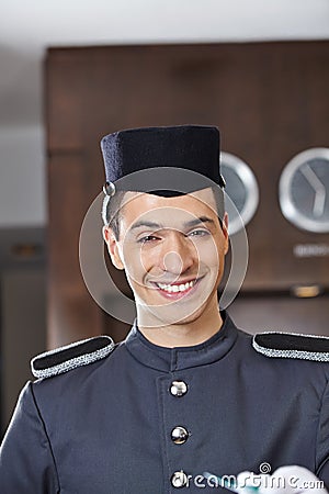 Happy hotel concierge smiling