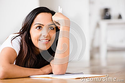 Happy Indian woman student education writing studying