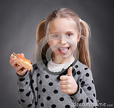 Happy little girl eating bread and butter with fish