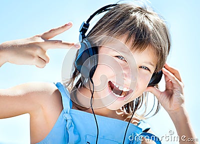 Happy little girl in headphones