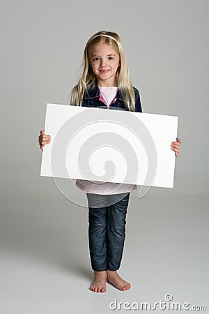 Happy little girl holding a blank sign