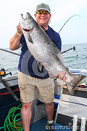 Happy Man with Huge Fish - Giant King Salmon