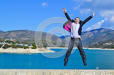 Happy man jumping with joy