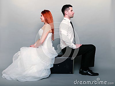 http://thumbs.dreamstime.com/x/happy-married-couple-bride-groom-gray-background-wedding-day-portrait-red-haired-full-length-sitting-old-suitcase-39573571.jpg