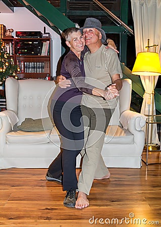 Happy middle-aged couple dancing