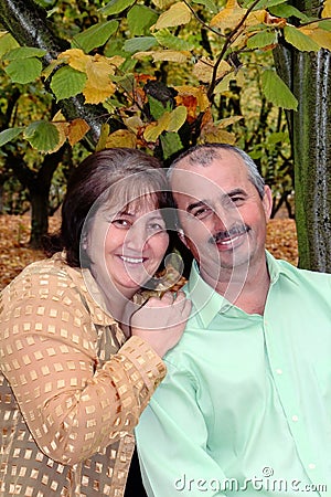 Happy Middle-aged couple in fall environment
