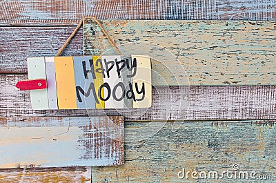 Happy or Moody sign board on wooden vintage background